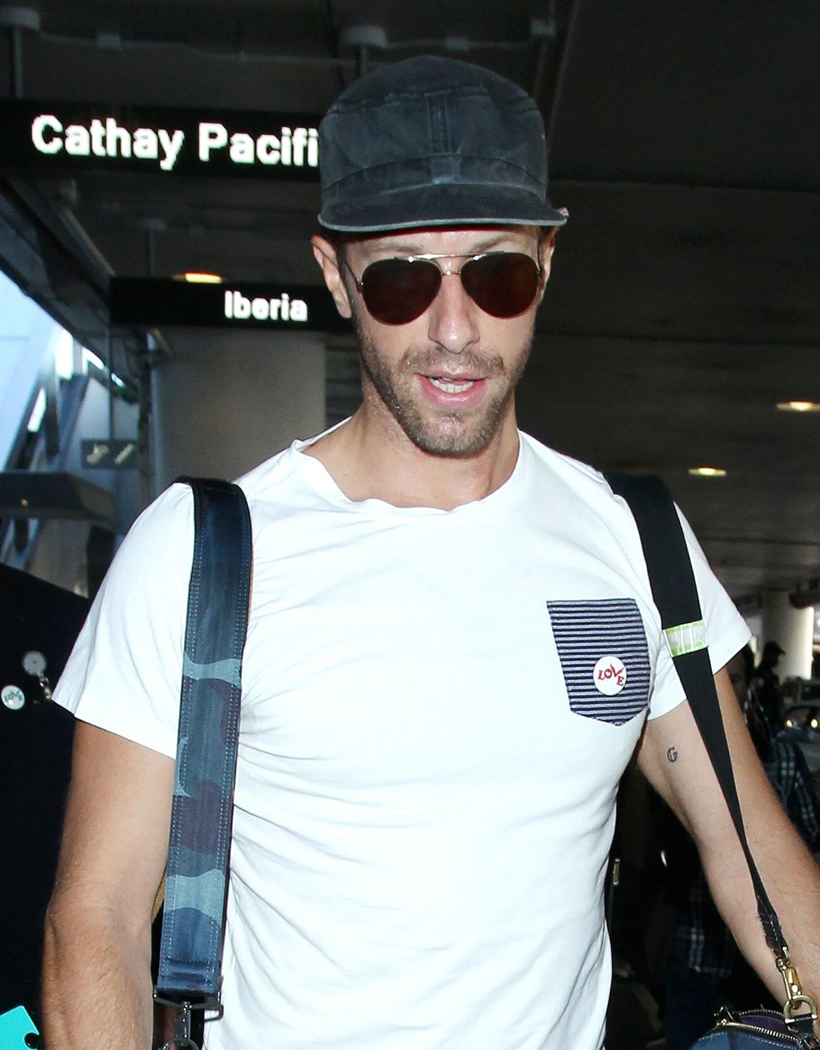Chris Martin arriving on a flight at LAX Airport - November 19