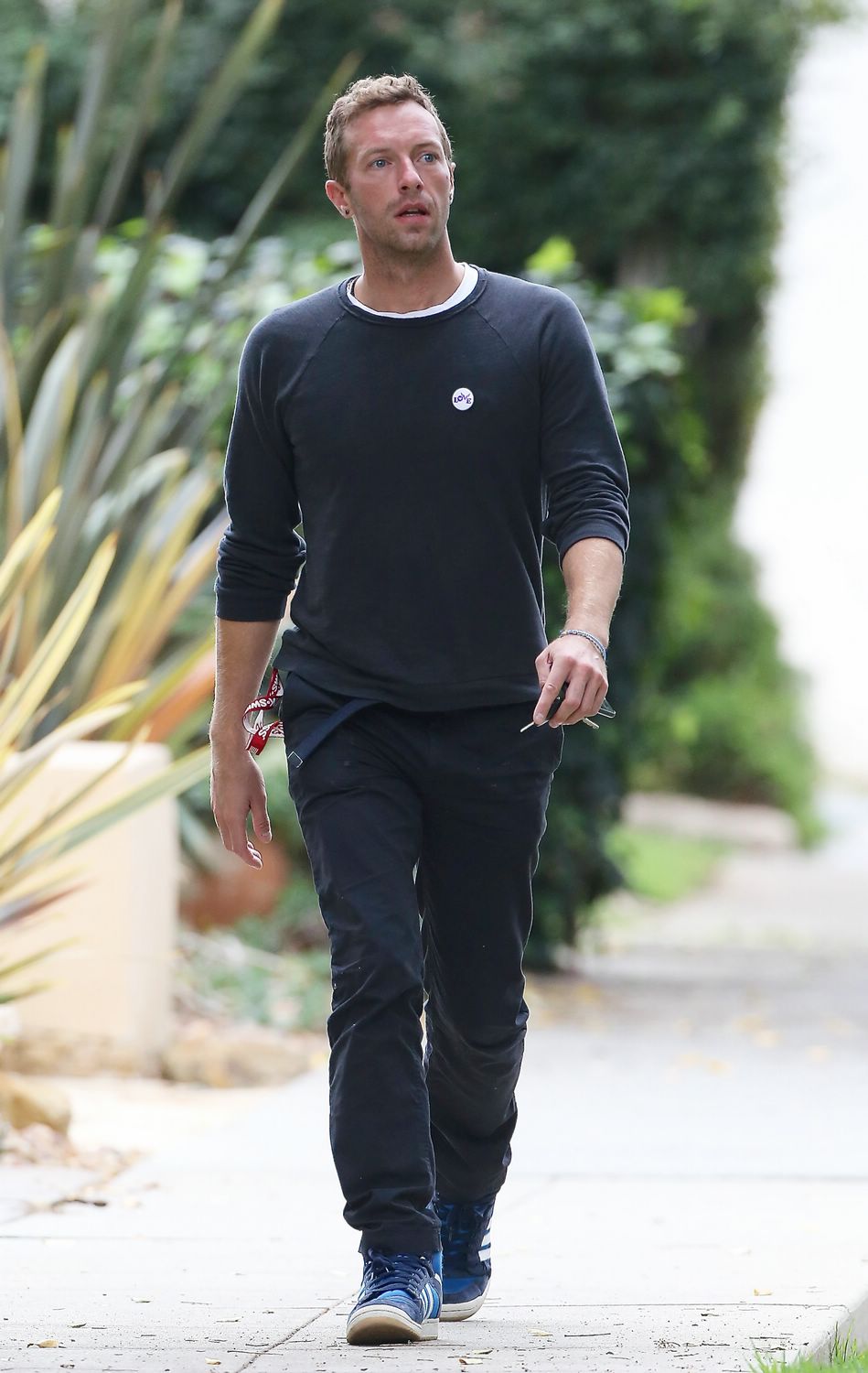 Singer Chris Martin is seen meeting a friend in Brentwood for lunch on November 20, 2014.