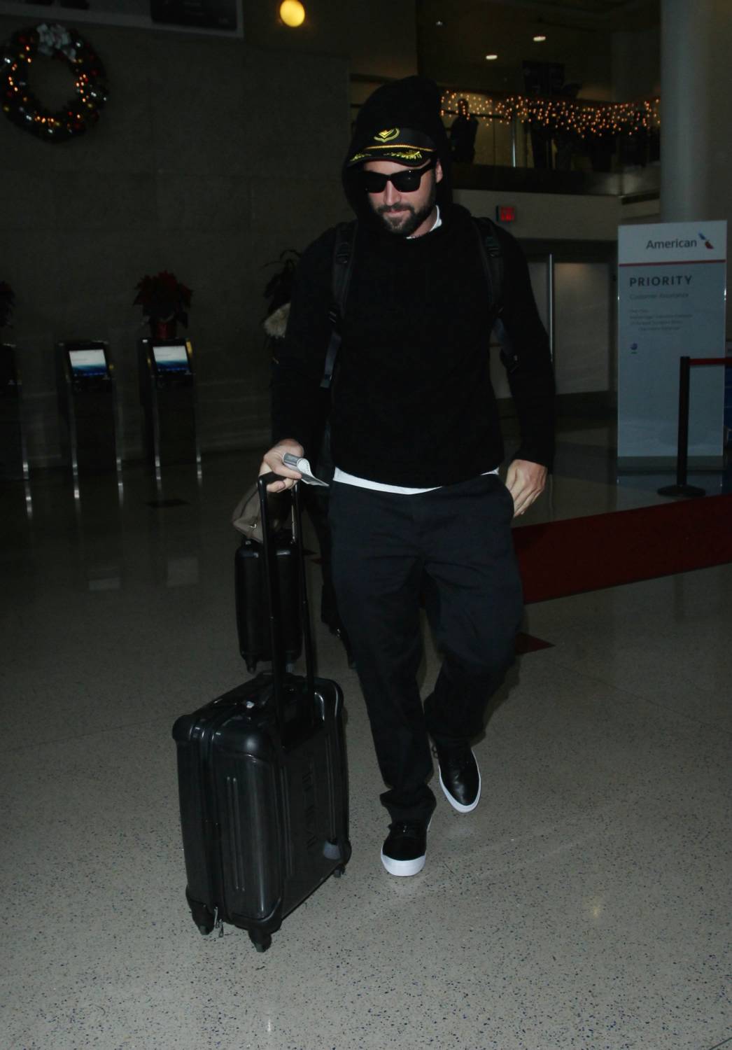 Brody Jenner is seen making his way through LAX airport with girlfriend Kaitlynn Carter, 30 December 2014.
