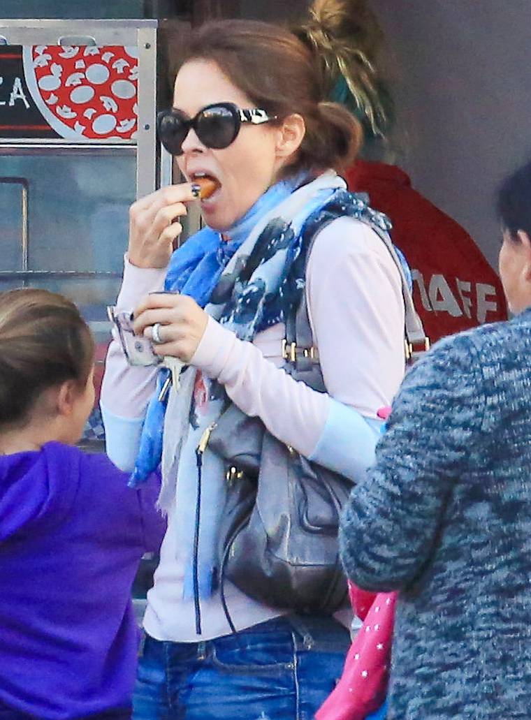 Brooke Burke has a snack while out with kids Shaya, Neriah and Heaven at Santa Monica Pier.