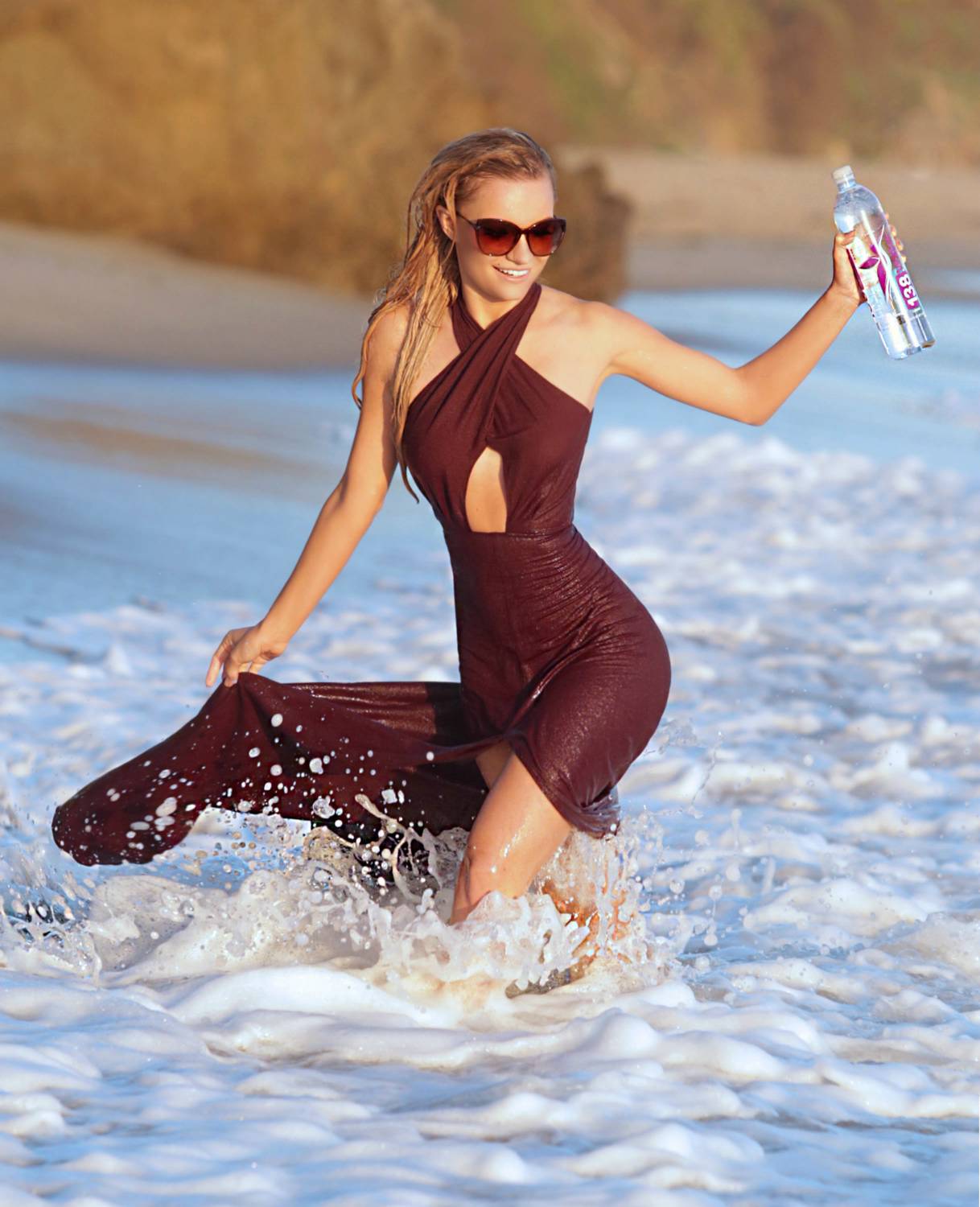 Model Caitlin O'Connor does a beach photo shoot for 138 Water in in Malibu, California on December 23, 2014.
