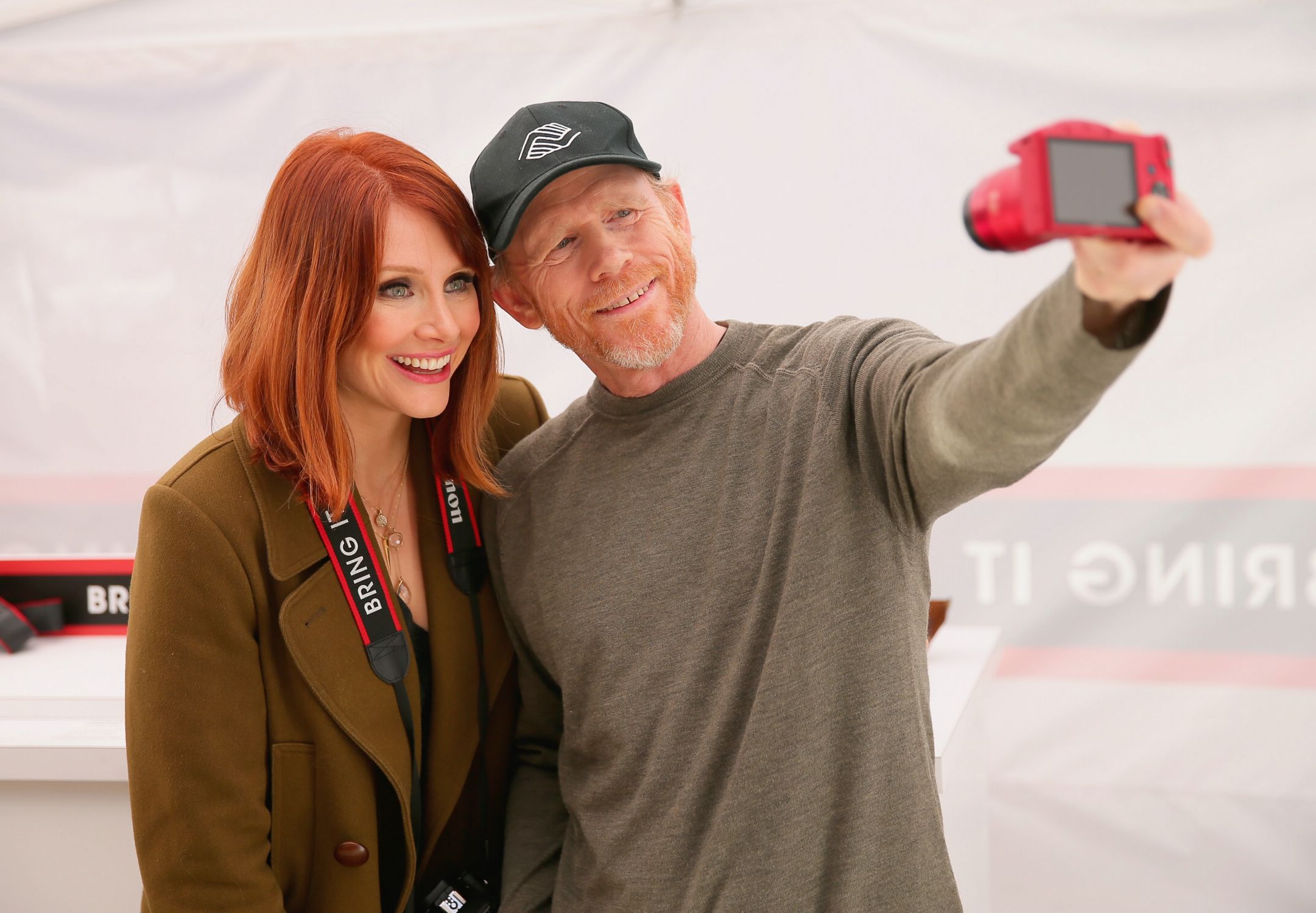 Actress Bryce Dallas Howard and her father, Director Ron Howards host the Canon 'Let It Snow' Globe spectacle at Hollywood & Highland on December 13, 2014 in Hollywood, California.