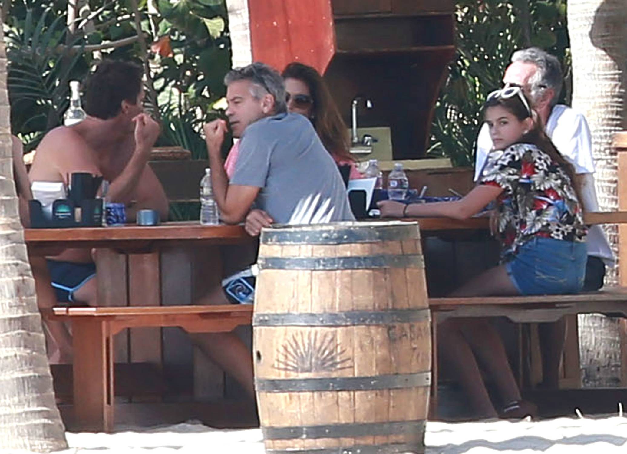 Actor George Clooney, his wife Amal Alamuddin and their friends, Cindy Crawford, Rande Gerber and their children Presley and Kaia relaxing on the beach in Cabo San Lucas, Mexico on December 22, 2014.