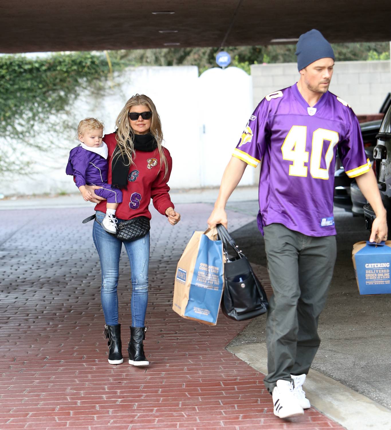 Fergie and Josh Duhamel are seen enjoying a shopping trip with their son Axl, 21 December 2014.