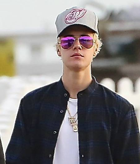 Justin Bieber takes a lonely walk on the pier in Malibu on December 19, 2014. Justin expresses his thoughts on his breakup with Selena Gomez.