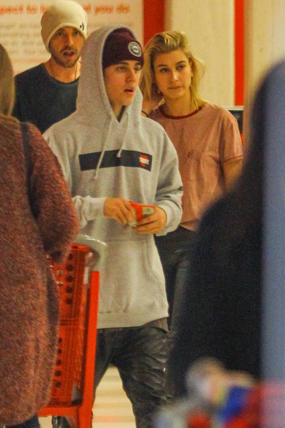 Justin Bieber and Hailey Baldwin get dinner at Sant Ambroeus in SoHo together, then go shopping at BLK DNM on November 29, 2014.