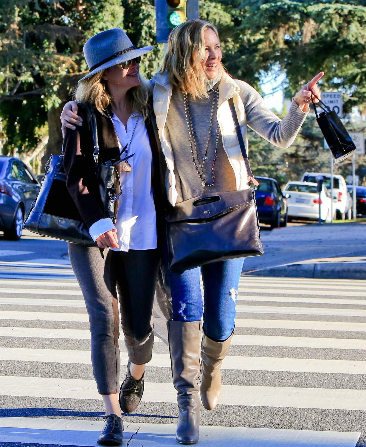 Maria Bello and girlfriend Clare Munn got out for a bit of holiday shopping in Santa Monica.