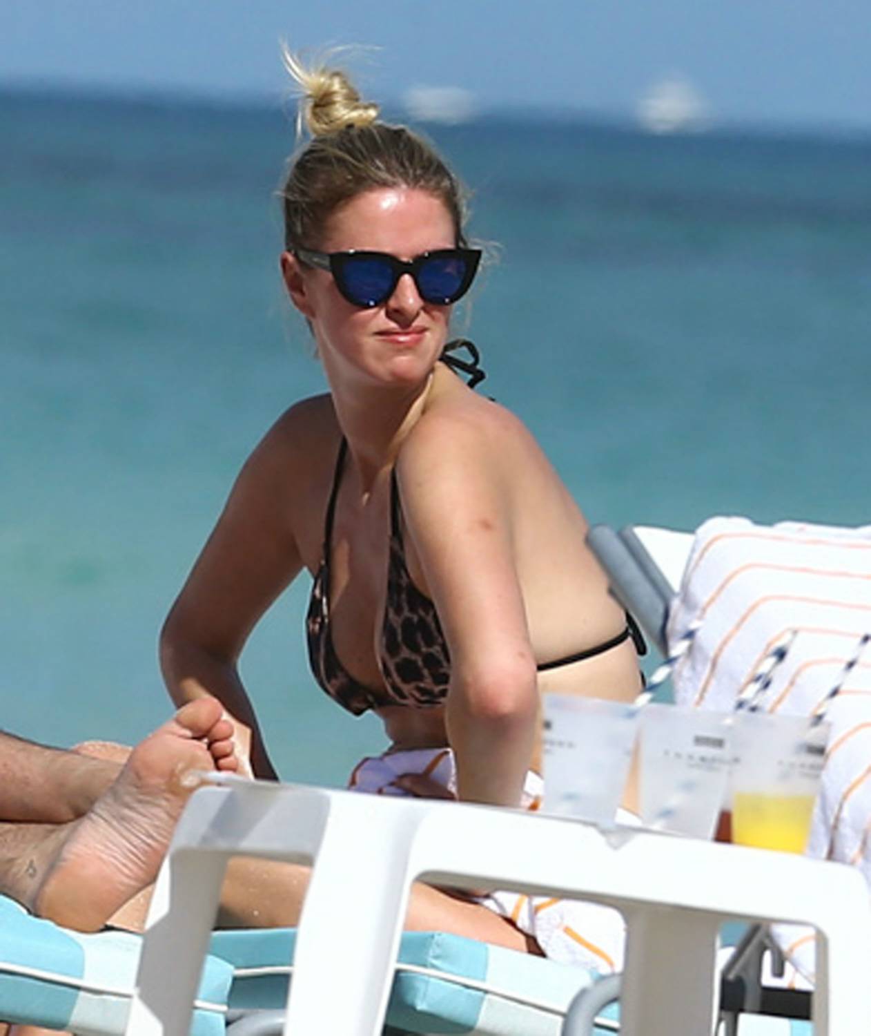 Socialite and author Nicky Hilton enjoys a day of relaxing in the sun in Miami, Florida on December 7, 2014.