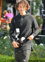 A shirtless Jaden Pinkett Smith stays in shape doing push ups at the beach in Hawaii on January 2, 2015.
