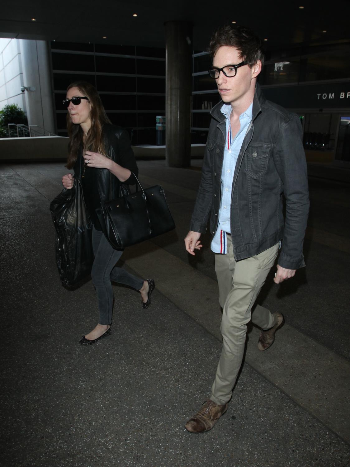 Eddie Redmayne Arrives at LAX with Wife Hannah Bagshawe - Feb 21st