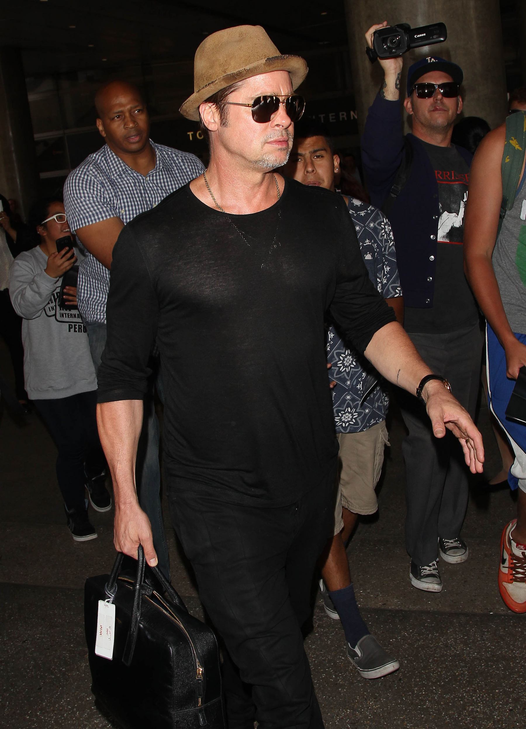 Brad Pitt Arrives at LAX Airport - July 31