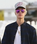 Justin Bieber takes a lonely walk on the pier in Malibu on December 19, 2014. Justin expresses his thoughts on his breakup with Selena Gomez.